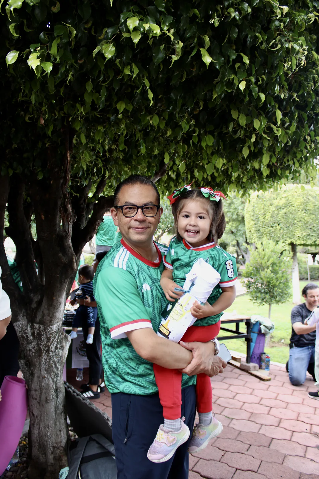 Dad holding his daughter
